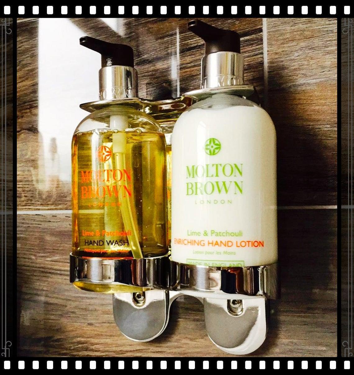 Chrome wall fixture double bottle holder by Milton Brown- London